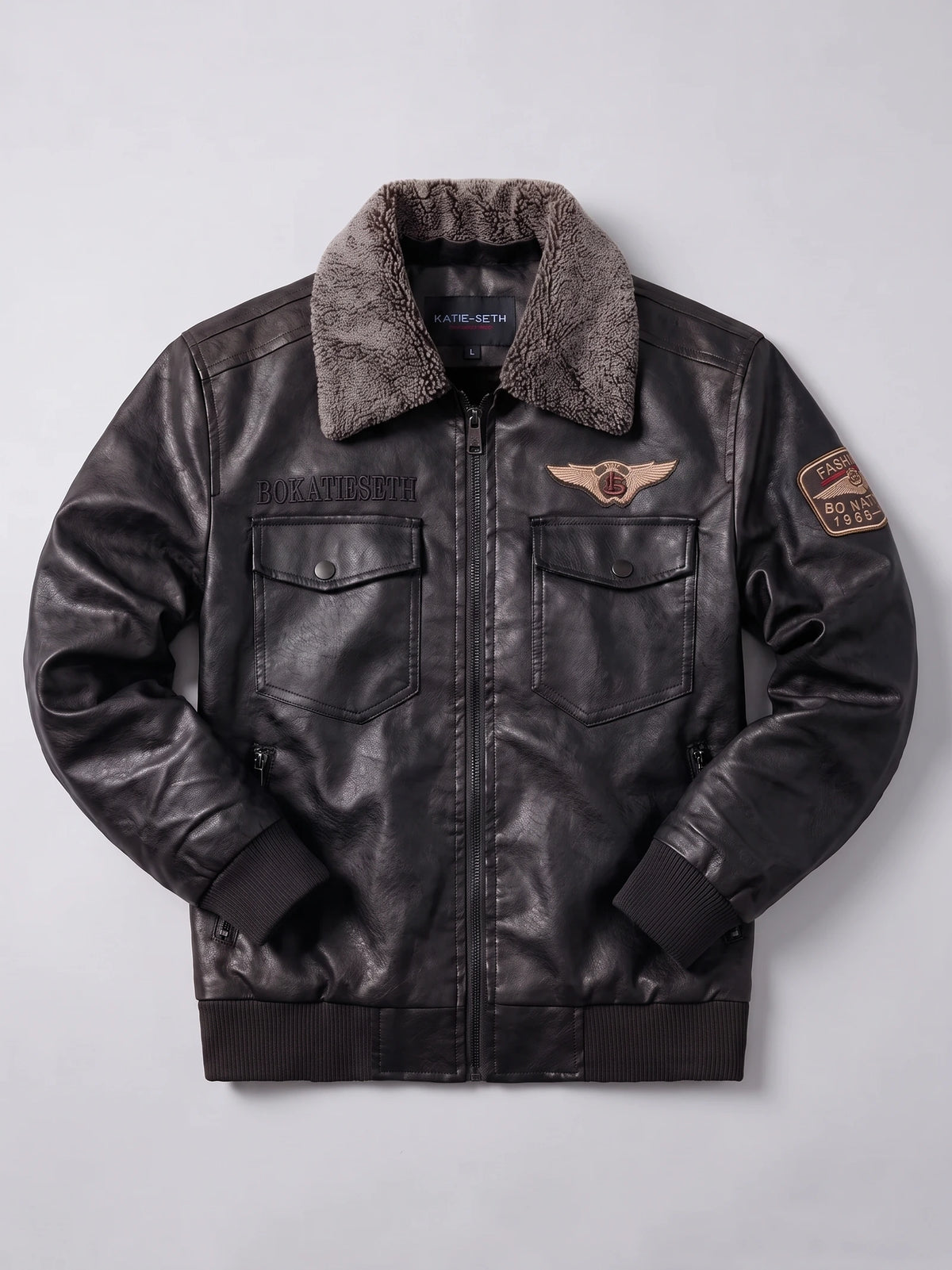 Black Leather Jacket laid flat, featuring a textured fur collar, front zipper, flap chest pockets, ribbed trim, and embroidered patches.