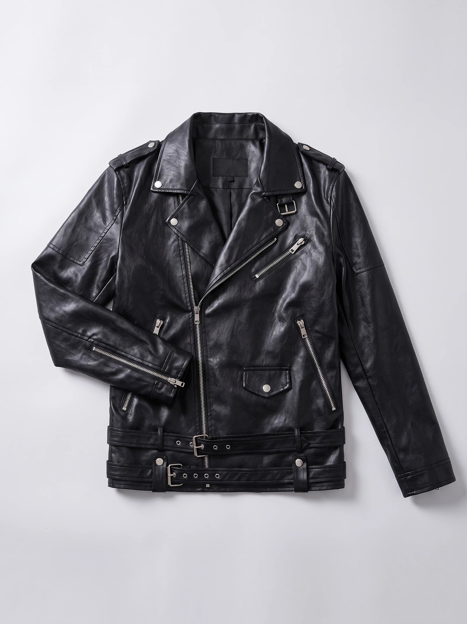 Black PU leather motorcycle jacket laid flat, showing an asymmetrical zip front, snap lapels, zip pockets, and belted waist.