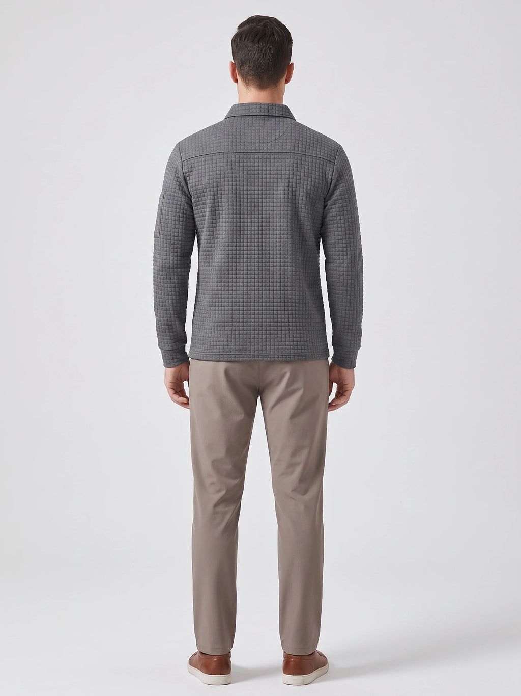 Rear studio view of a model wearing a Gray long sleeve cotton polo with a textured grid-knit finish.