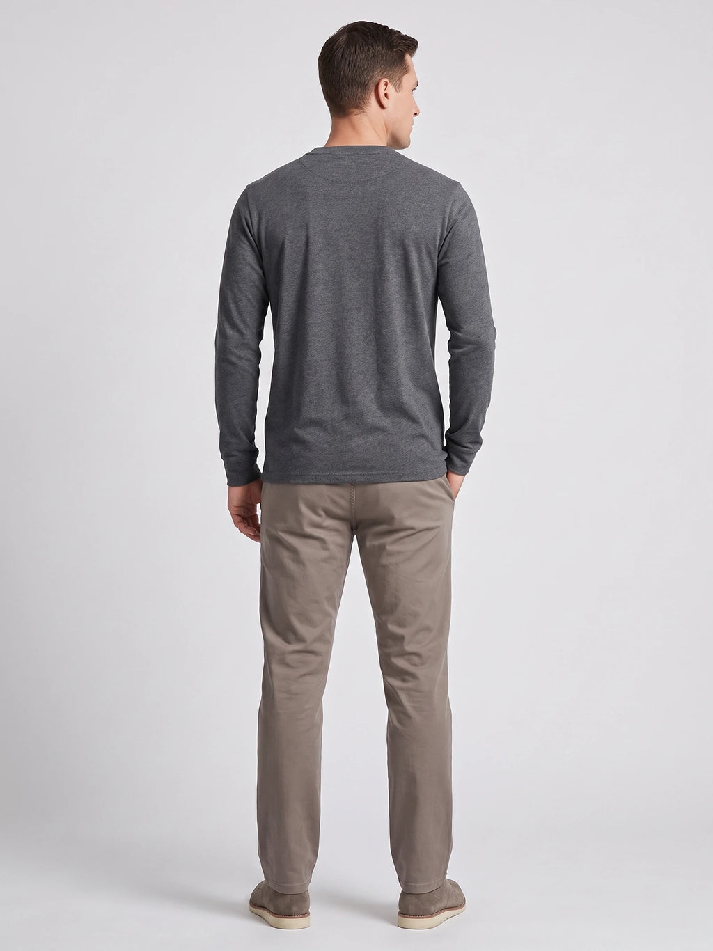 Rear studio view of a model wearing a Gray cotton long sleeve Henley shirt.