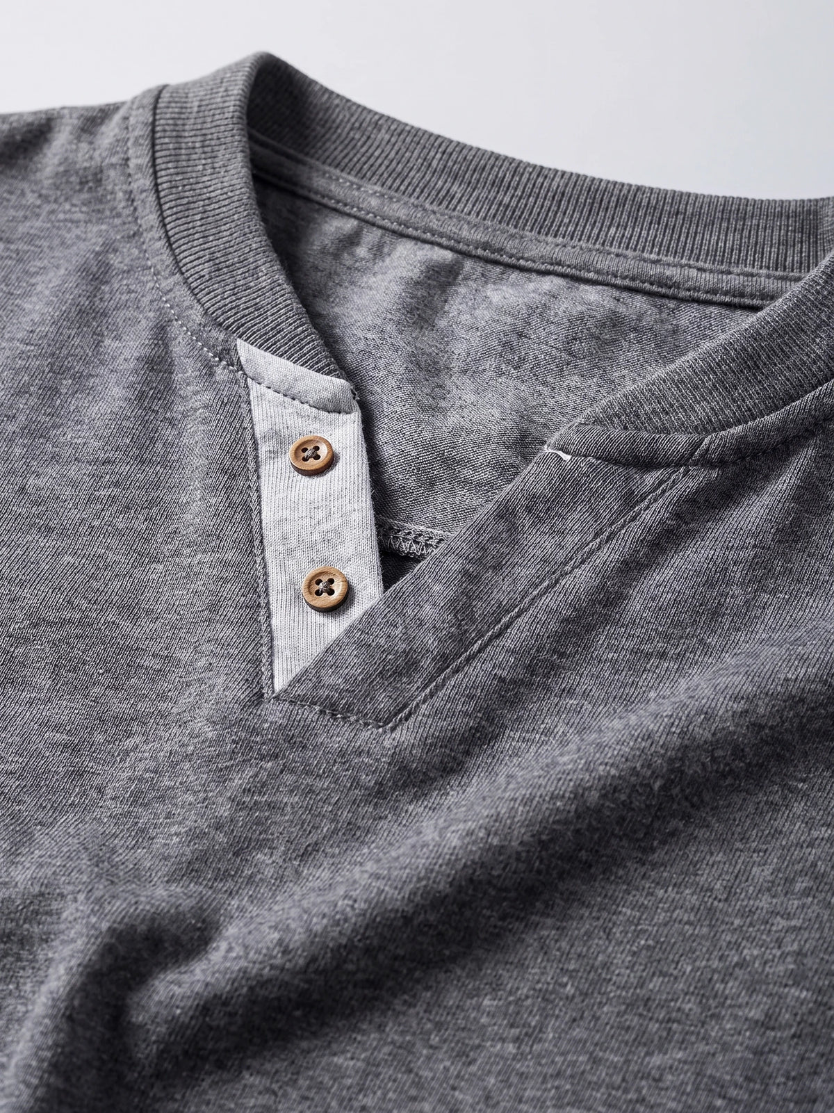 Gray cotton Long Sleeve Henley Shirt detail showing the ribbed collar and two-button placket.