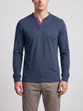 Front studio view of a model wearing a Navy cotton long sleeve Henley shirt with a two-button placket.
