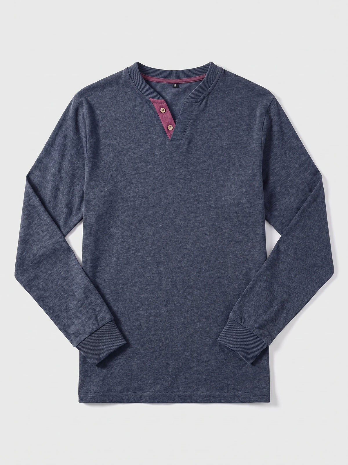 Navy cotton long sleeve Henley shirt laid flat, featuring a ribbed collar and cuffs with a two-button placket.
