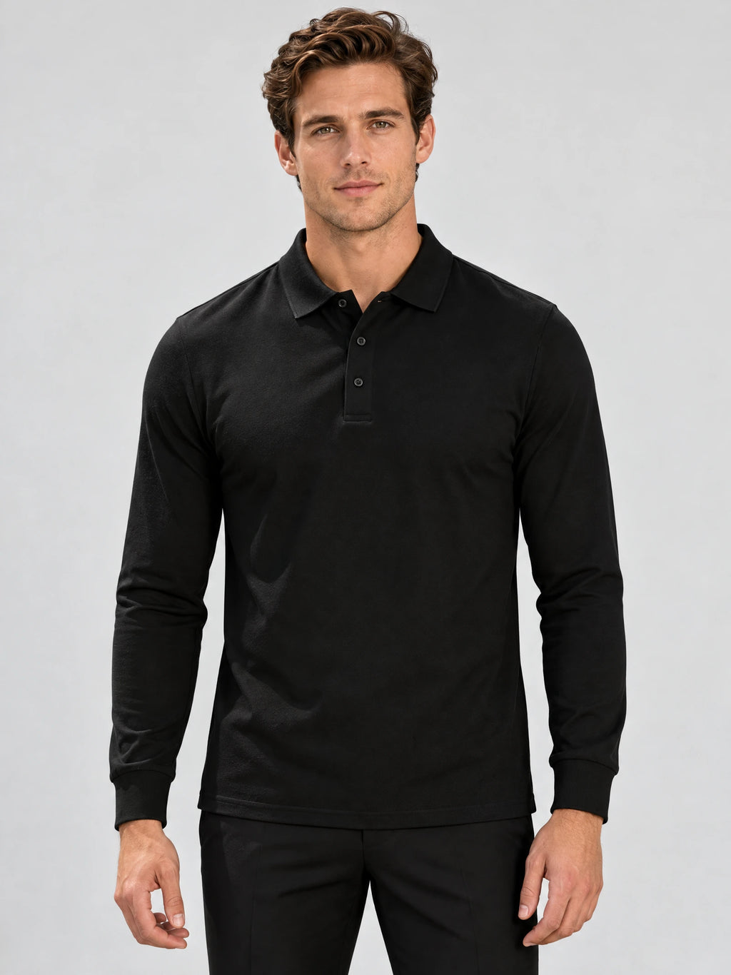 Front studio view of a model wearing a Black Long Sleeve Polo with a button placket and ribbed cuffs.