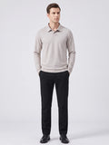 Model wearing a Beige long sleeve polo with an embroidered turn-down collar in a front studio view.