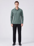 Front studio view of a model wearing a Green long sleeve polo with a turn-down collar and button placket.