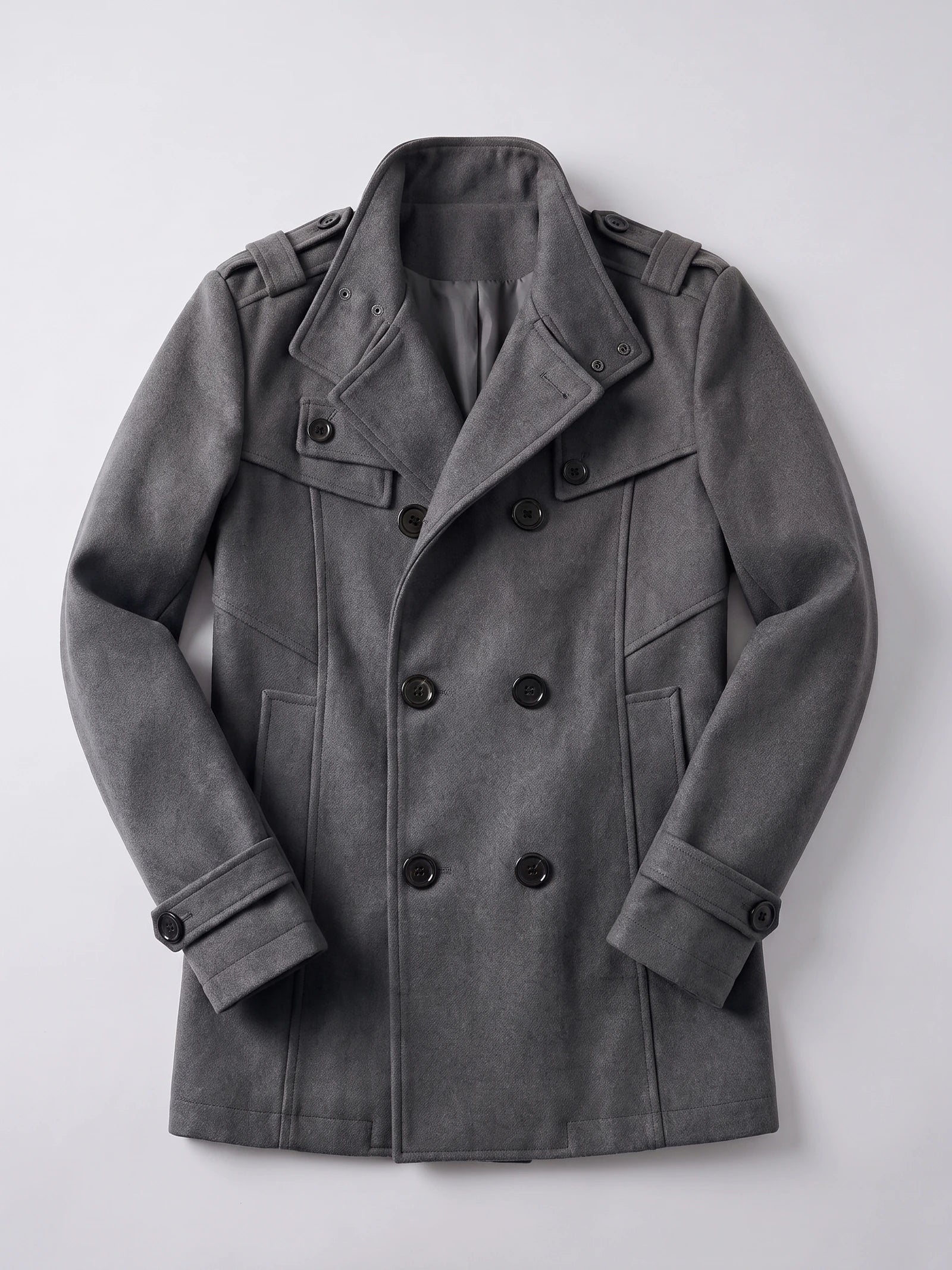 Gray wool men's overcoat laid flat, featuring a double-breasted button front, wide collar, shoulder tabs, and belted cuffs.