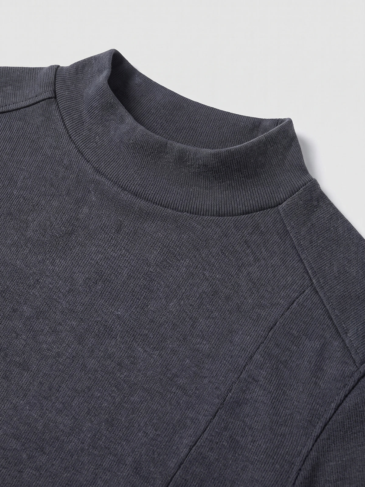 Close-up of the Gray men's Mock Neck Sweater showing its ribbed stand collar, fine knit texture, and shoulder seam.
