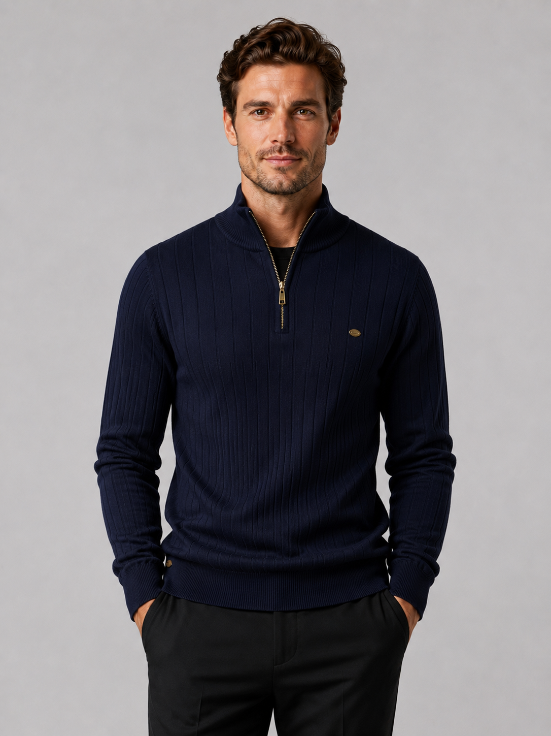 Front view of a man wearing a navy quarter zip pullover sweater with a stand collar, warm cotton knit, and long sleeves