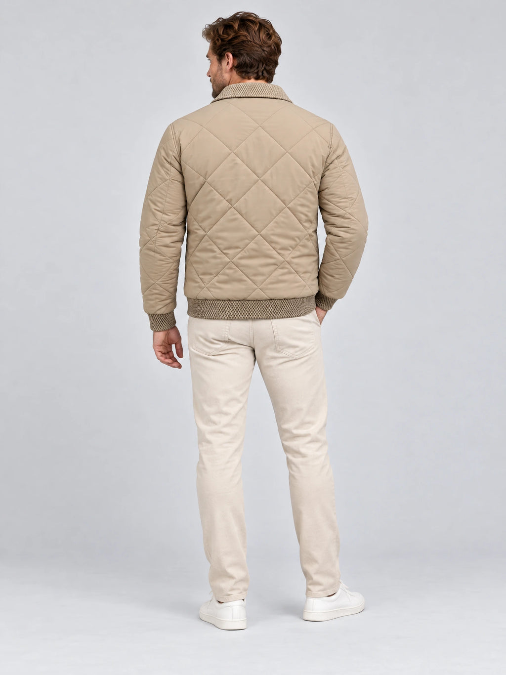 Rear studio view of a model wearing a Beige Men Padded Lapel Jacket with diamond quilting and patterned rib-knit hem and cuffs.