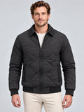 Front studio view of a model wearing a Black Men Padded Lapel Jacket with diamond quilting, zip closure, and textured collar and cuffs.