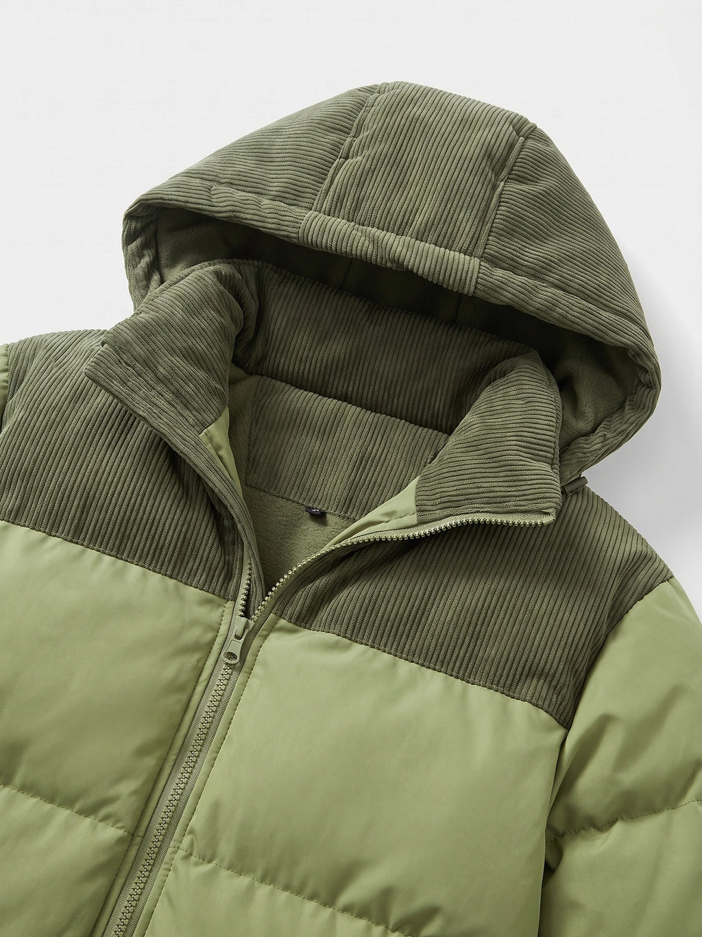 Green padded puffer jacket detail showing the ribbed hood, fleece lining, high collar, and front zipper.