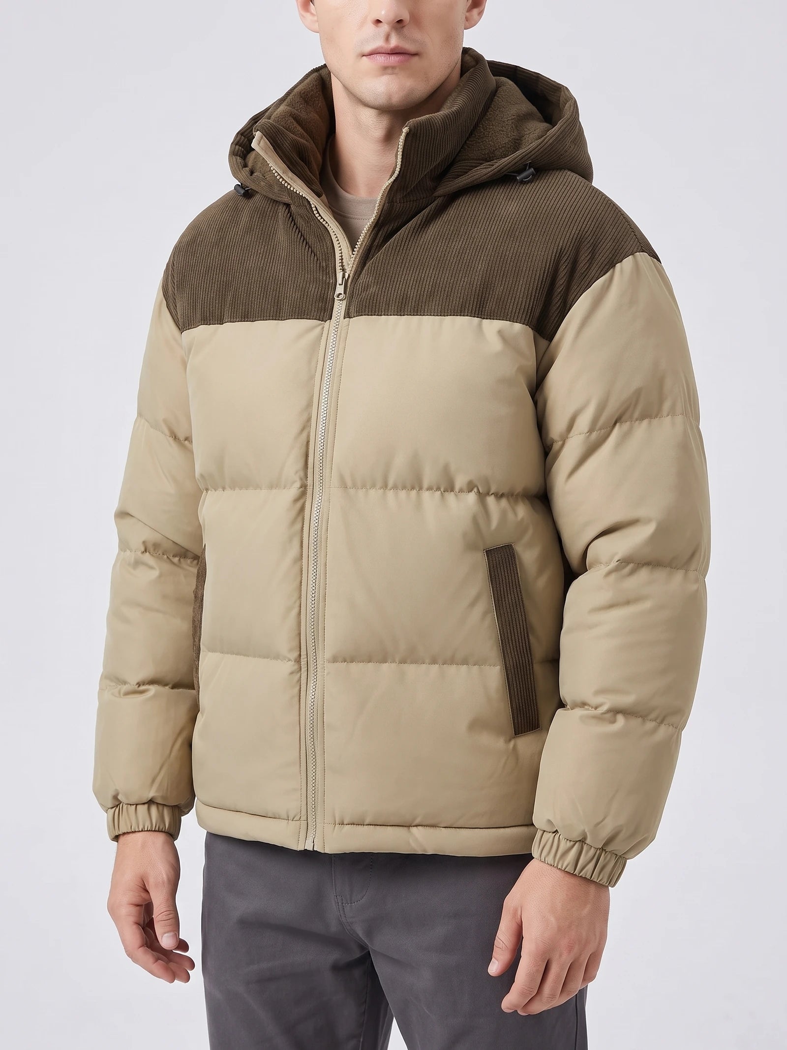 Model wearing a Khaki padded puffer jacket in a front studio view, with a hood, front zipper, and quilted sleeves.