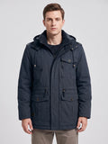 Front studio view of a model wearing a Navy men’s Parkas jacket with a hood, zip front, and flap pockets.