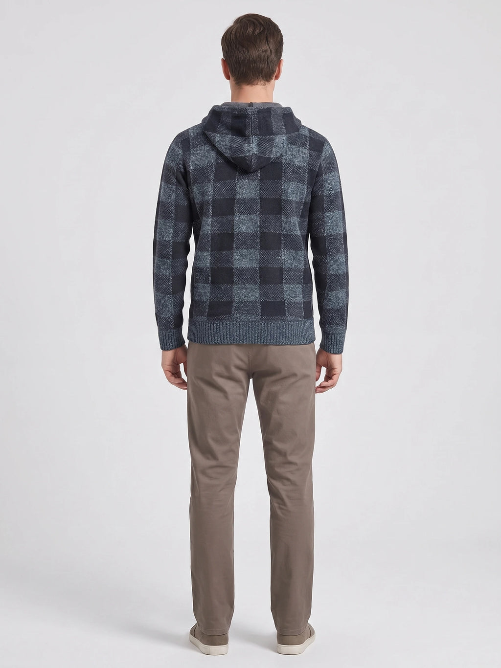 Rear studio view of a model wearing a Blue Plaid Flannel hooded men's jacket with ribbed cuffs and hem.