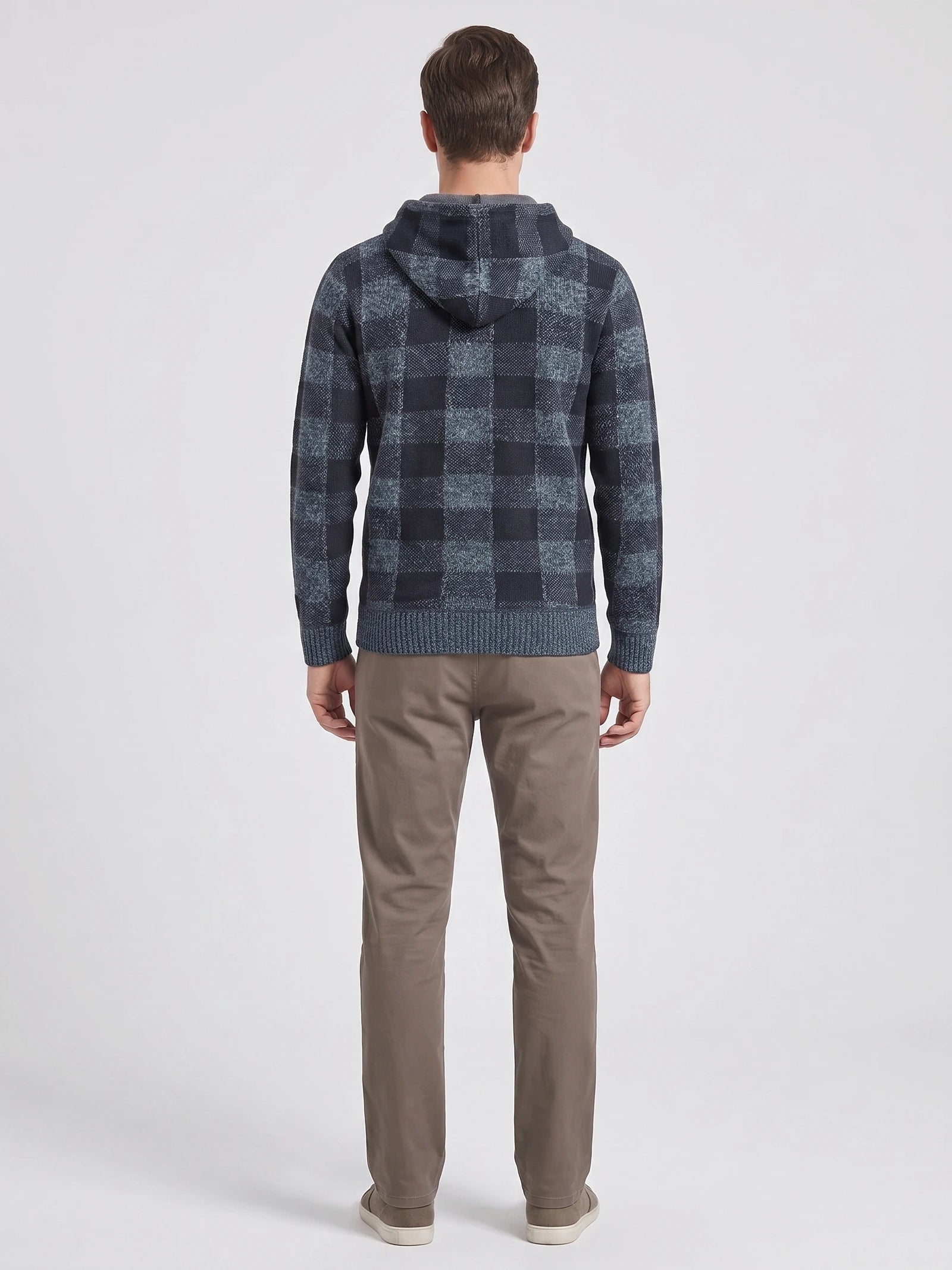 Rear studio view of a model wearing a Blue Plaid Flannel hooded men's jacket with ribbed cuffs and hem.