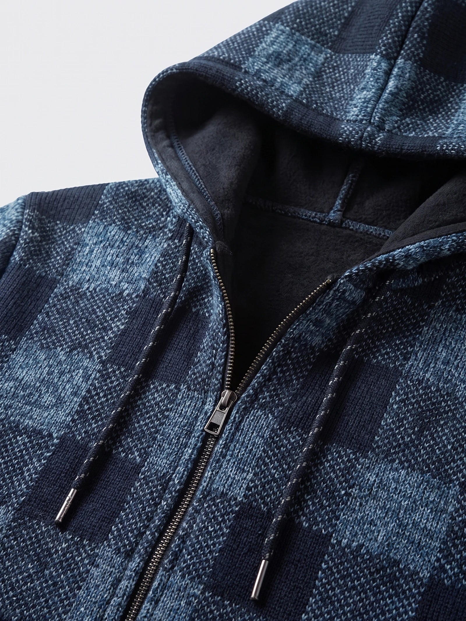 Close-up of the Blue Plaid Flannel men's jacket showing its fleece-lined hood, drawstrings, and front zipper.