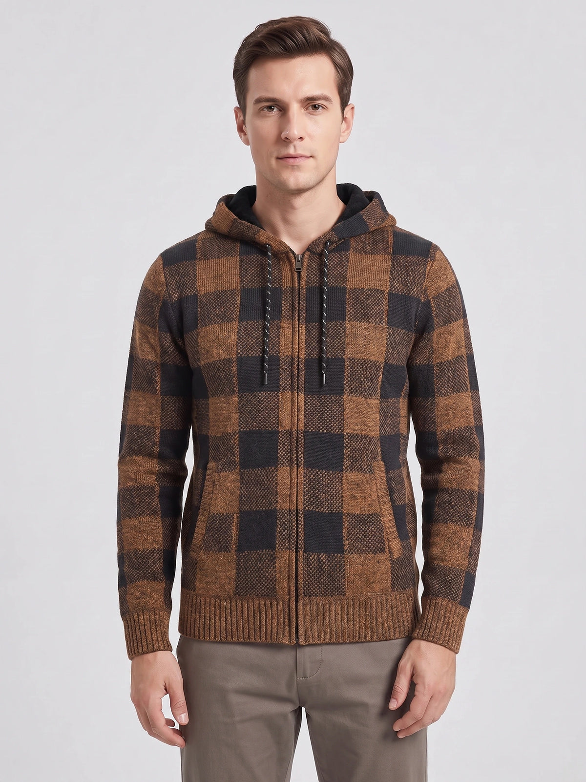 Front studio view of a model wearing a Brown Plaid Flannel hooded zip-up men's jacket with ribbed cuffs and hem.