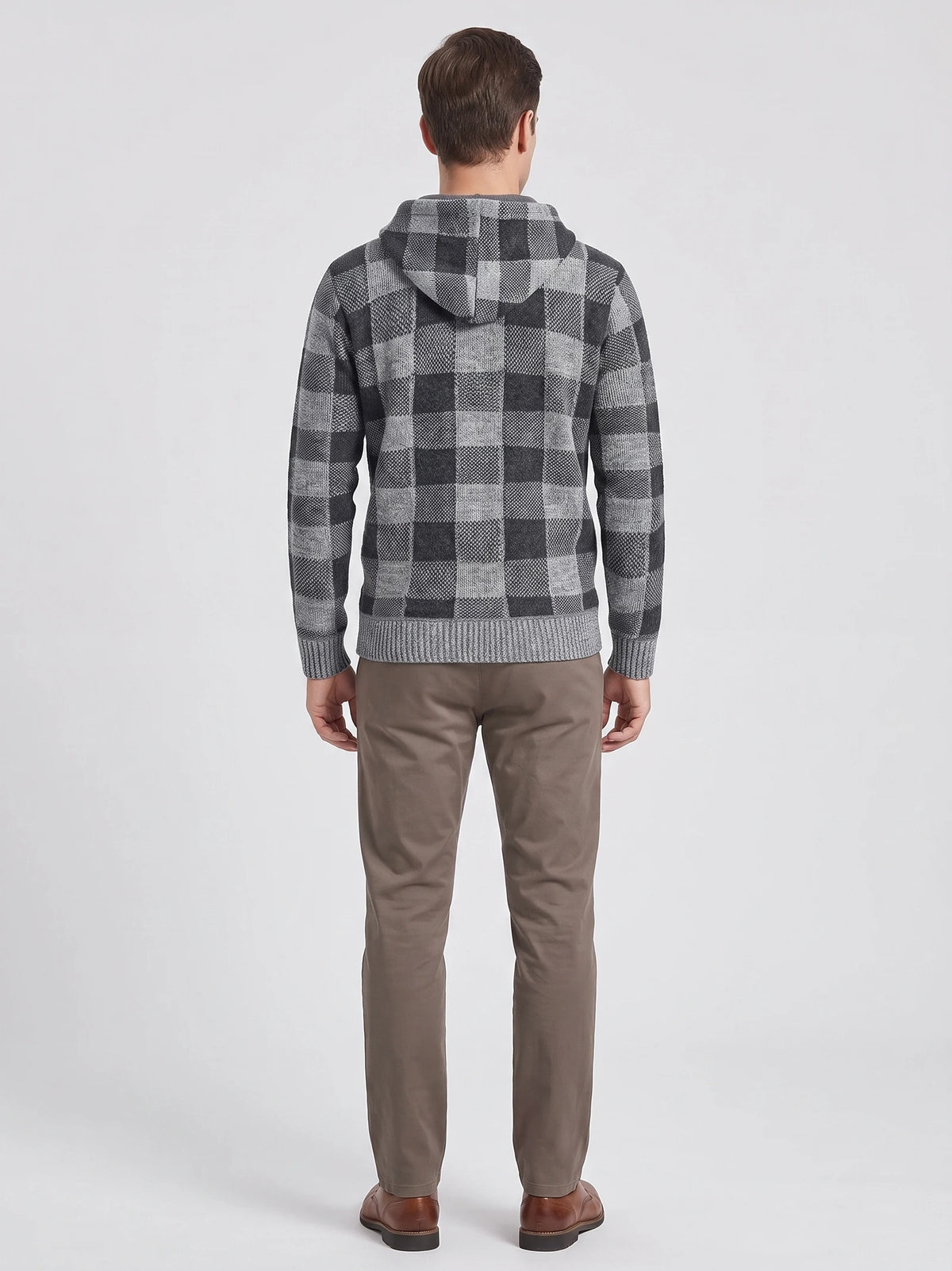 Rear studio view of a model wearing a Gray Plaid Flannel hooded men's jacket with ribbed cuffs and hem.
