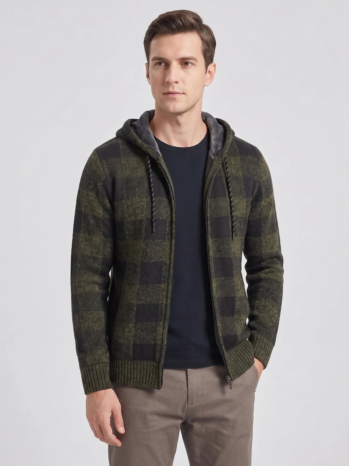 Front studio view of a model wearing a Green Plaid Flannel hooded jacket with a zip front and ribbed cuffs.