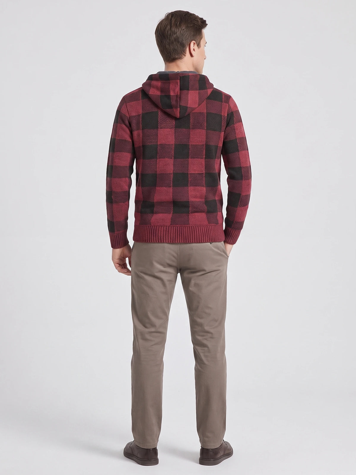 Rear studio view of a model wearing a Wine Plaid Flannel hooded men's jacket with ribbed cuffs and hem.