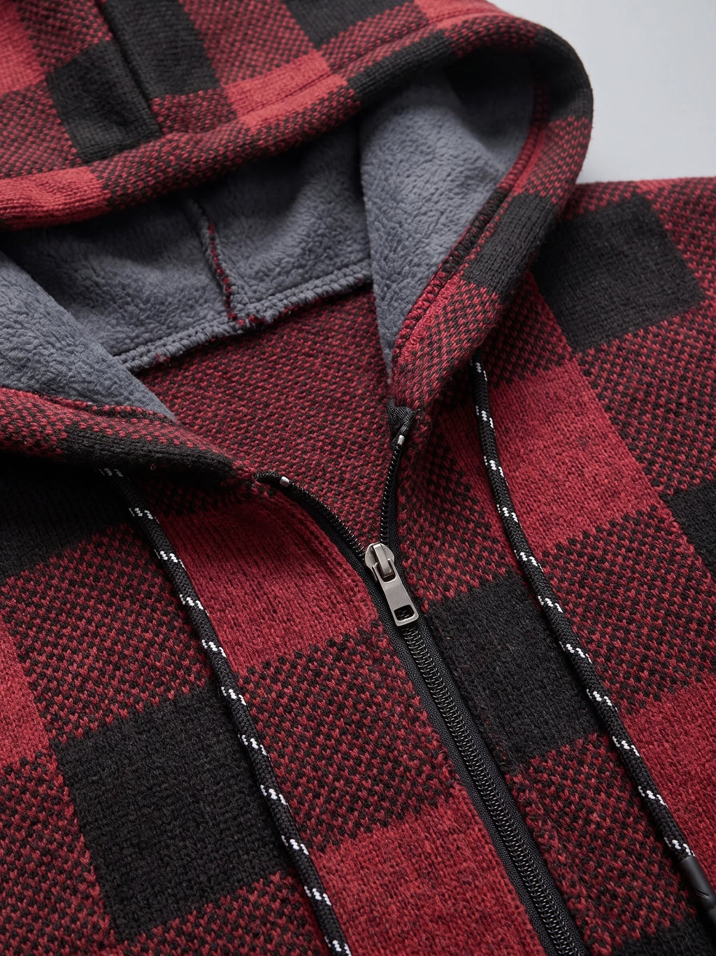 Close-up of the Wine Plaid Flannel men's jacket hood, showing the soft fleece lining, front zipper, and drawcords.