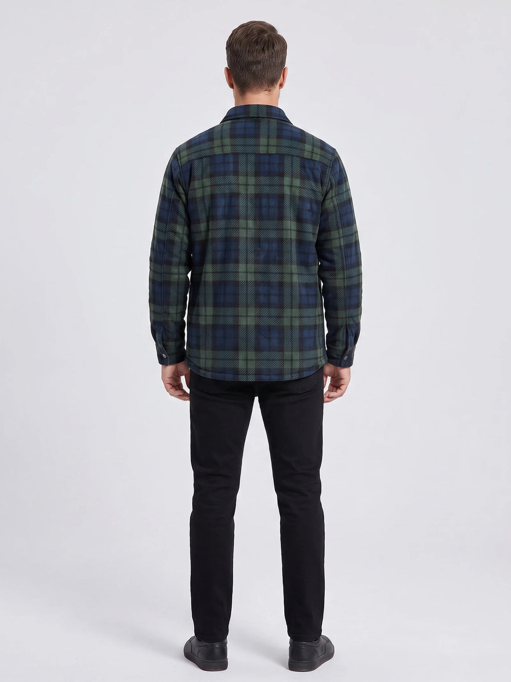 Rear studio view of a model wearing a Green plaid Flannel Jacket with long sleeves and a straight hem.