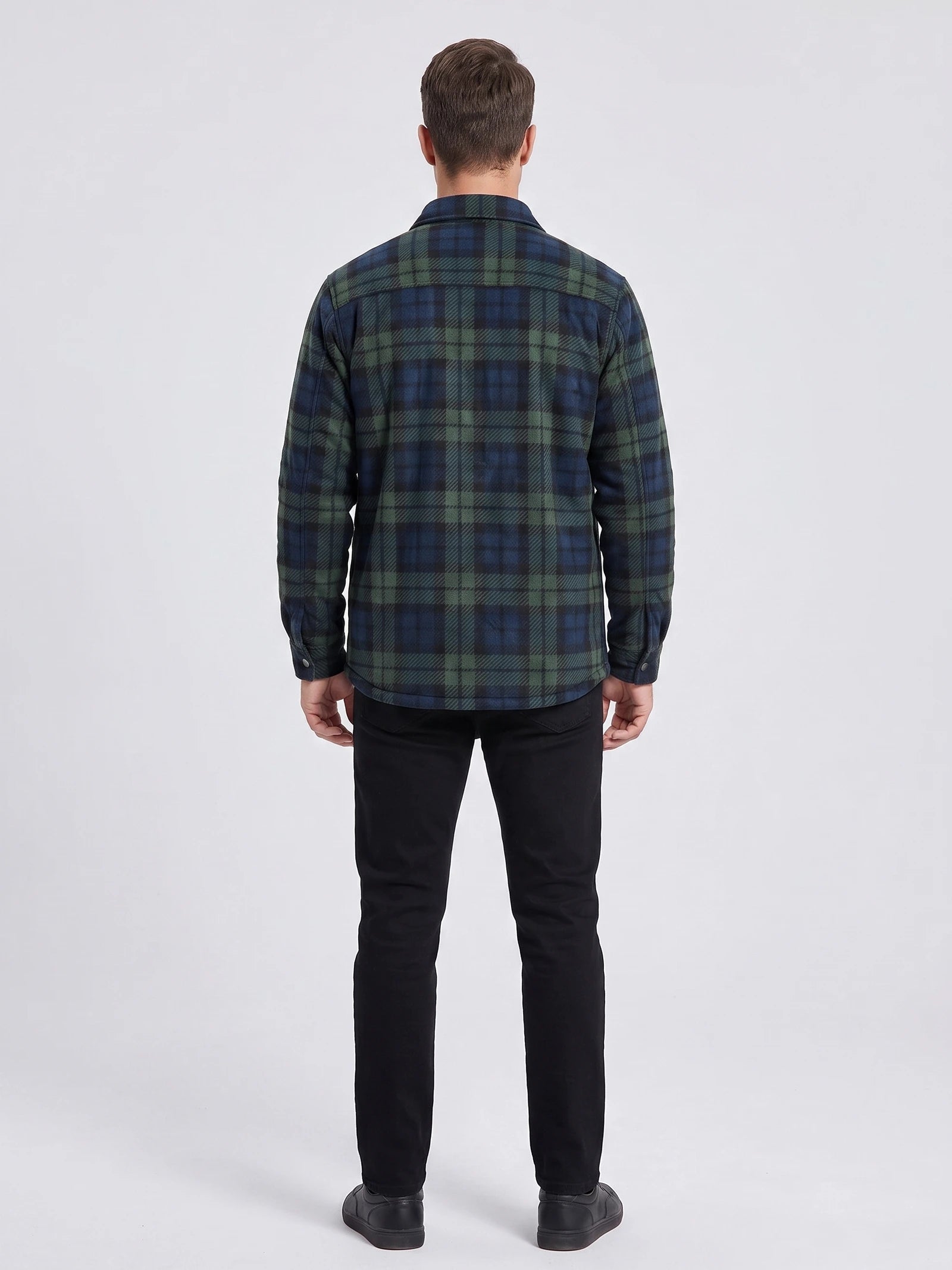 Rear studio view of a model wearing a Green plaid Flannel Jacket with long sleeves and a straight hem.