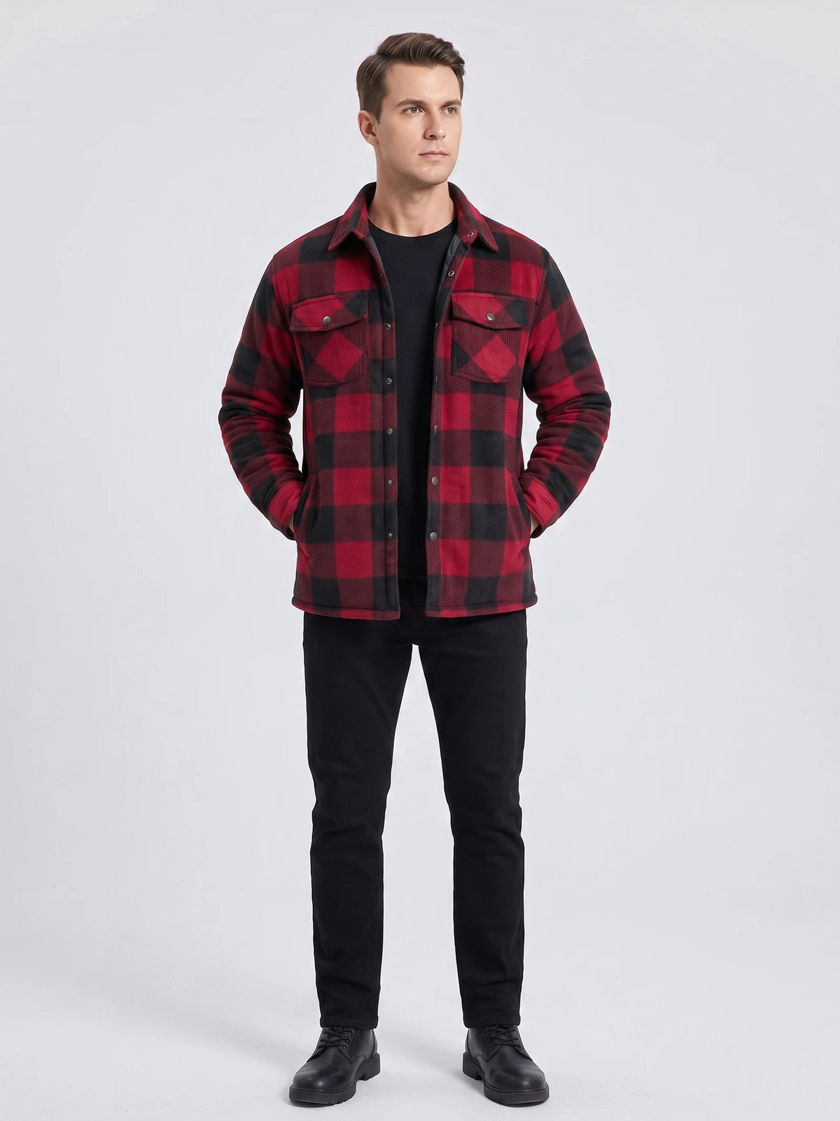 Front studio view of a model wearing a Red plaid flannel jacket with snap-button chest pockets and a button-up front.