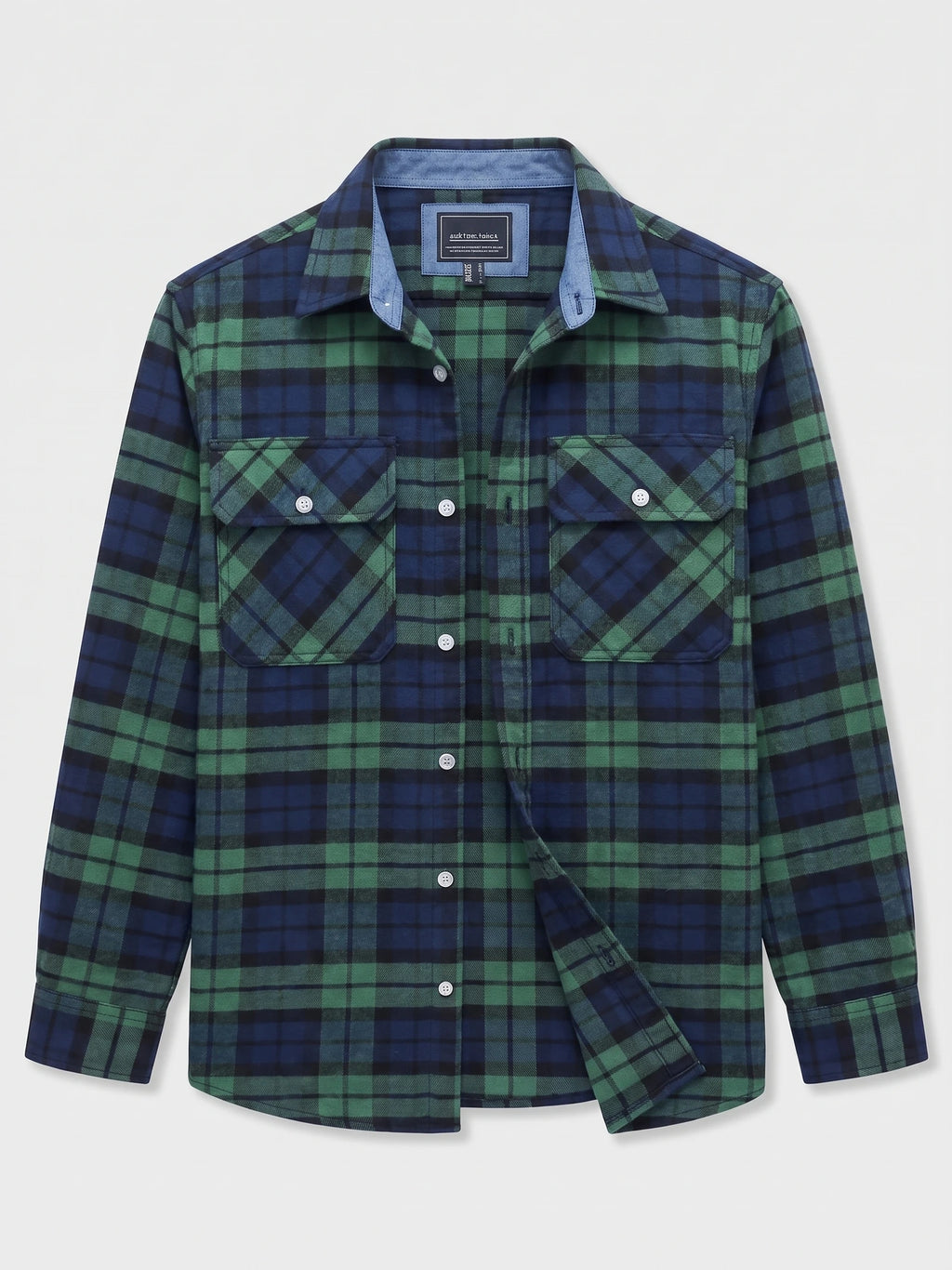 Green plaid flannel shirt laid flat, showing a button-down front, pointed collar, and two button-flap chest pockets.
