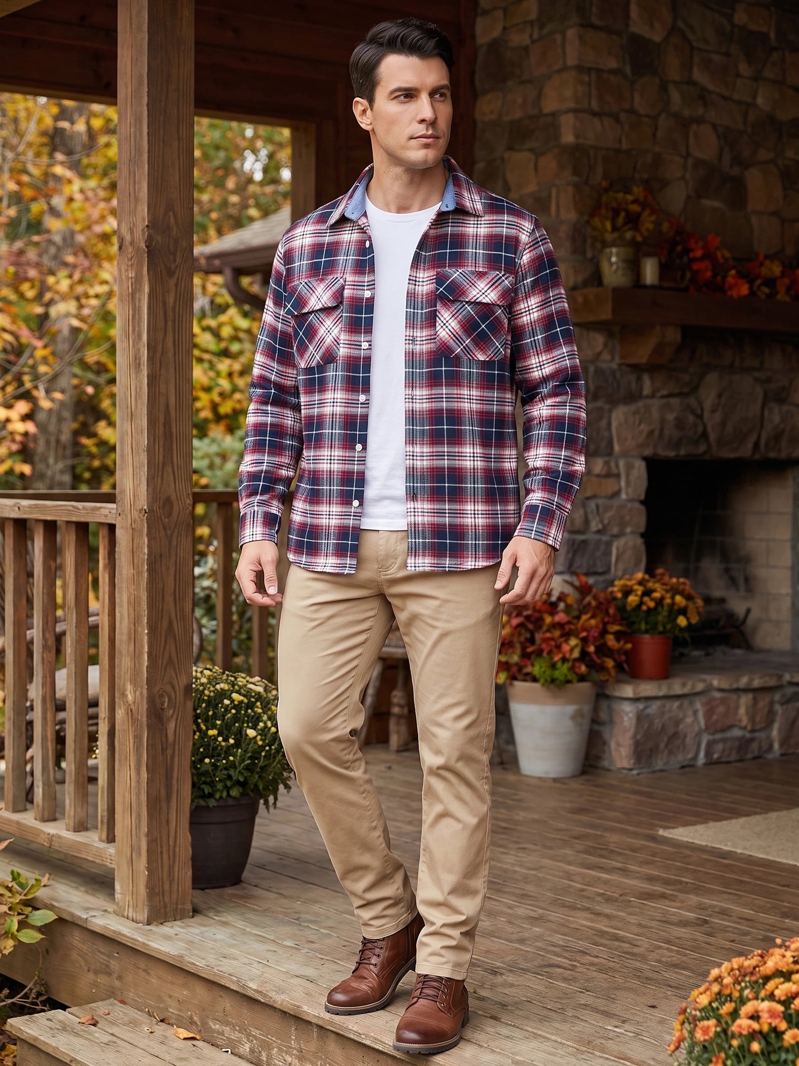 Man wearing a Red plaid flannel shirt jacket with buttoned chest pockets on a wooden porch beside a stone fireplace.