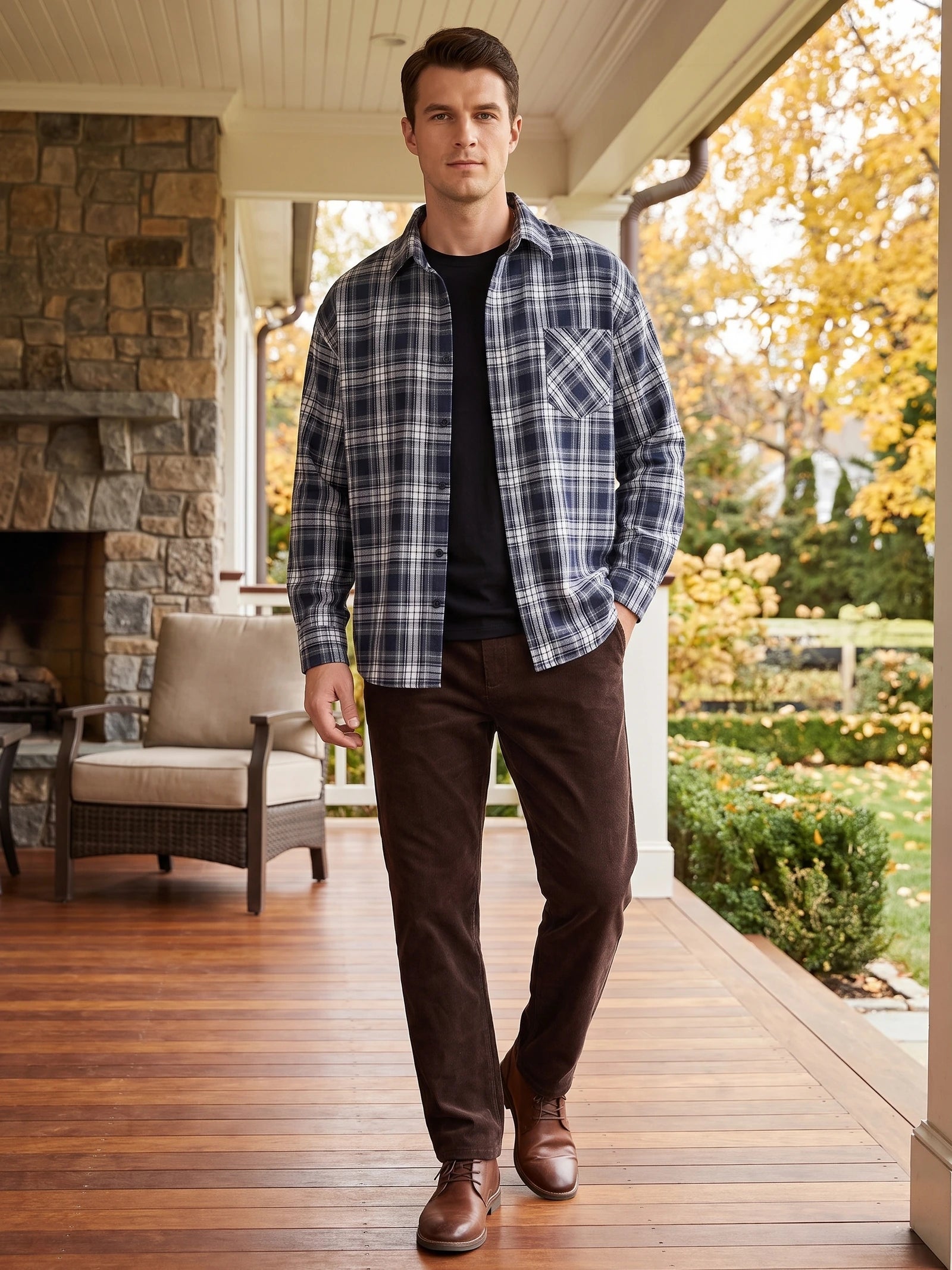 Model wearing a Navy plaid Flannel Shirt with a chest pocket while walking on a covered porch.