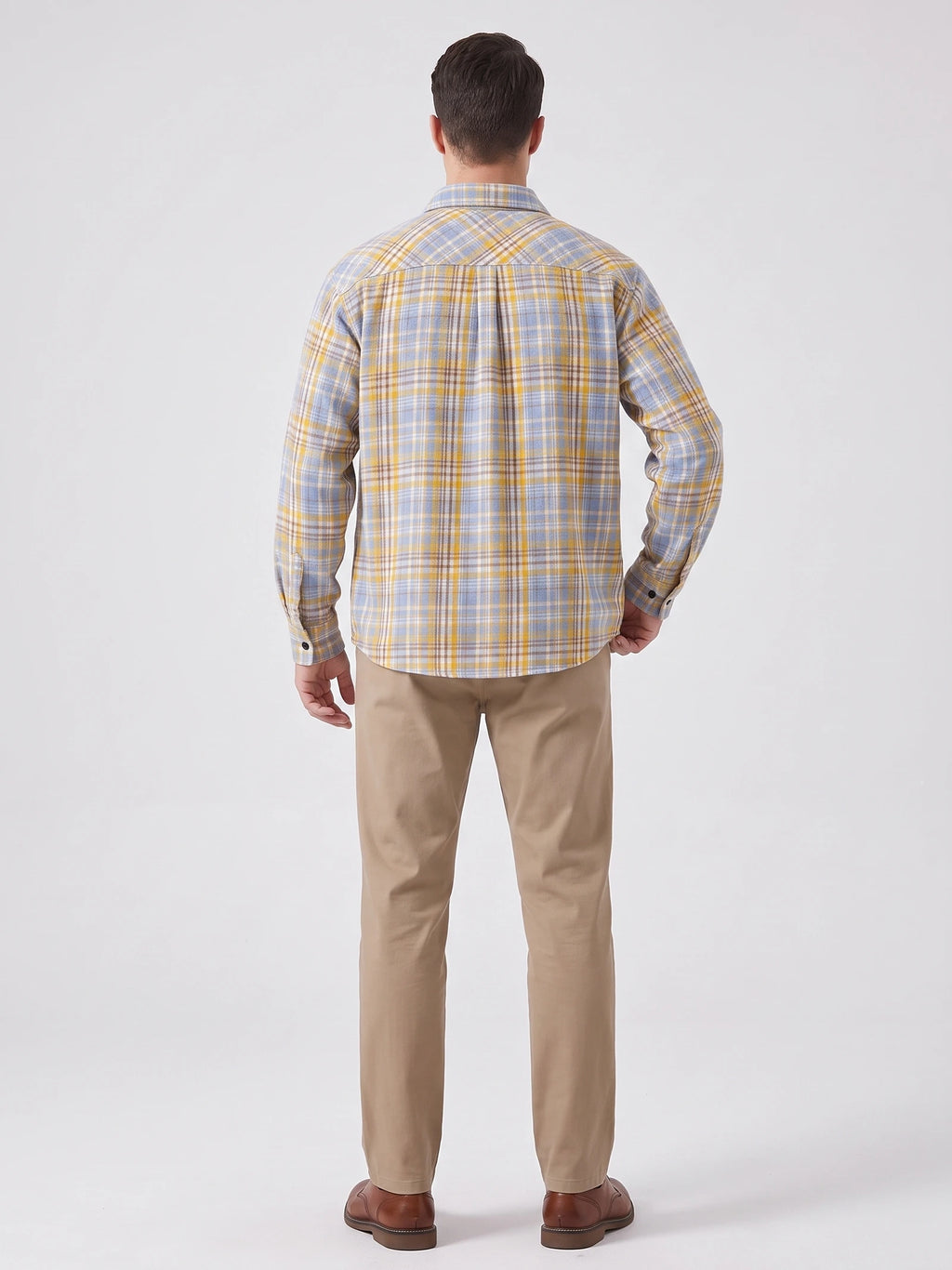 Rear studio view of a model wearing a Yellow plaid long-sleeve Flannel Shirt.