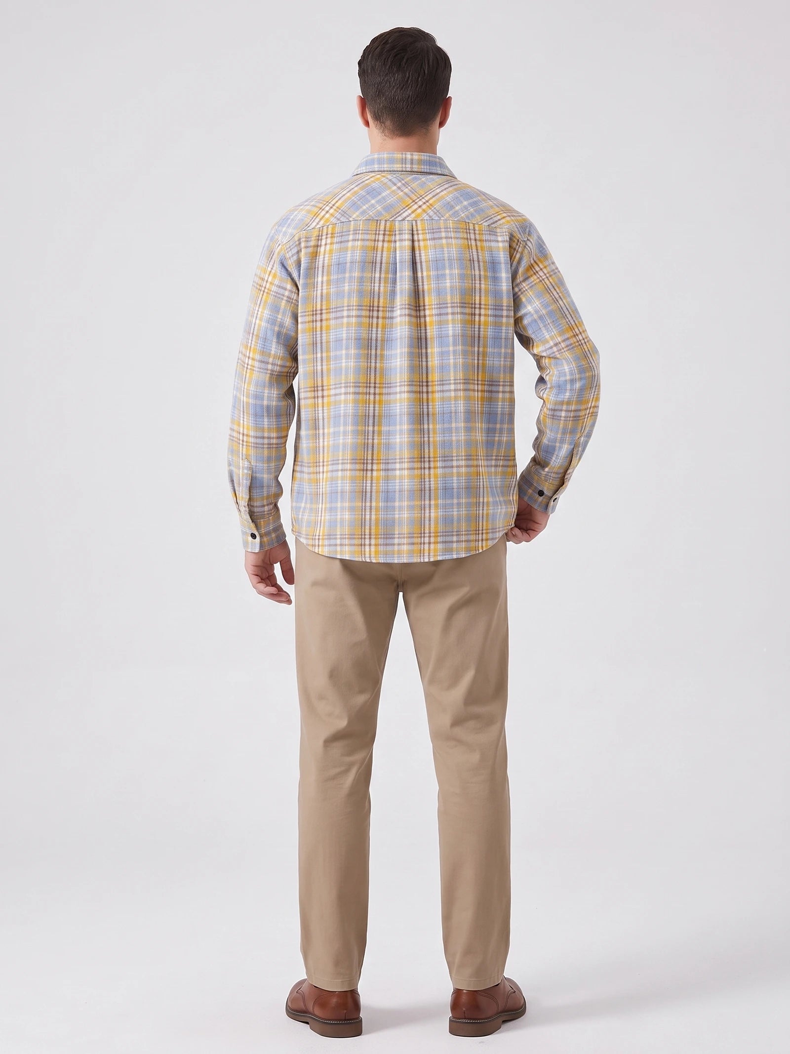 Rear studio view of a model wearing a Yellow plaid long-sleeve Flannel Shirt.