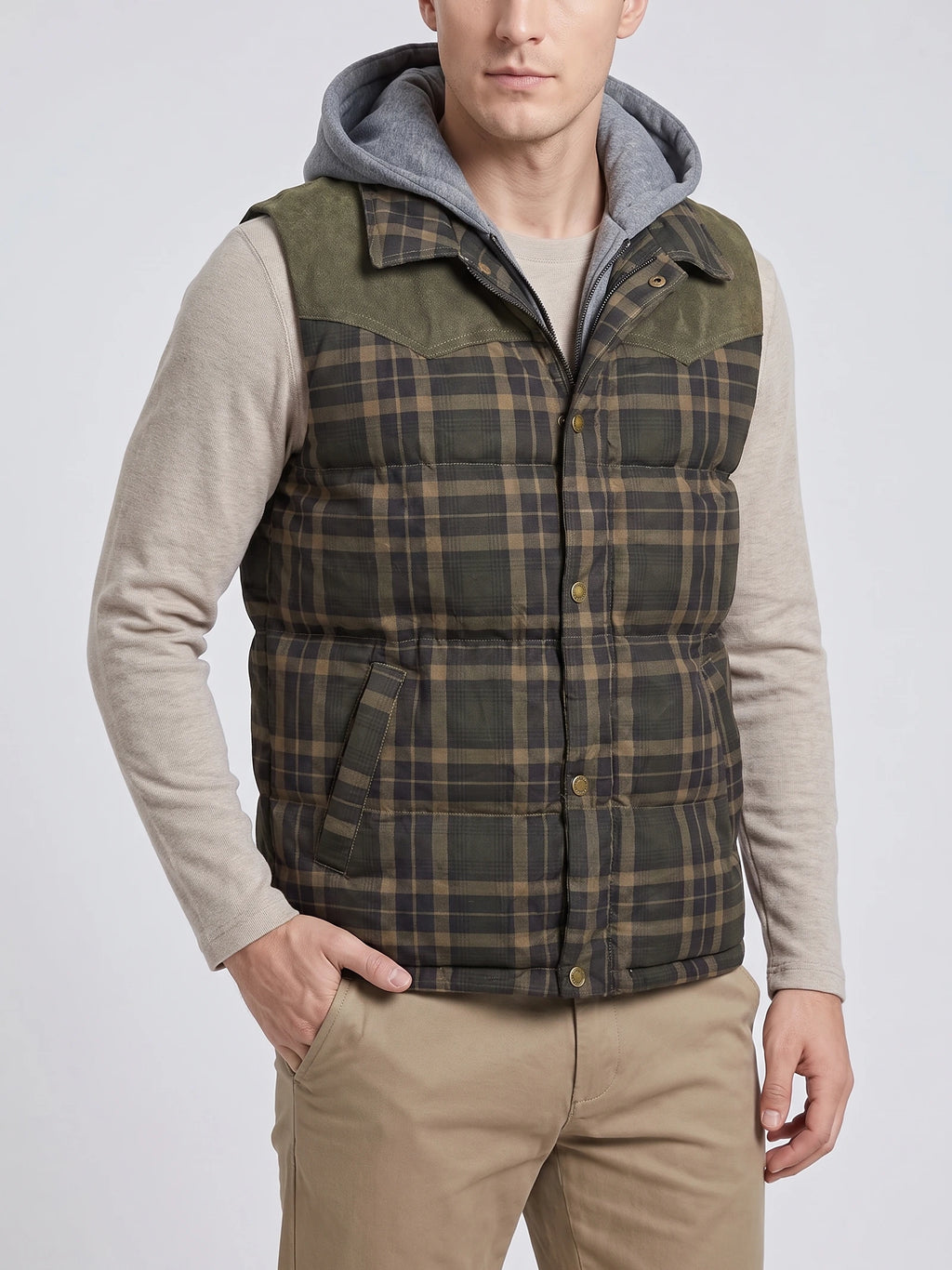 Front studio view of a model wearing a Green plaid Puffer Vest with a zip-and-snap front and angled pockets.