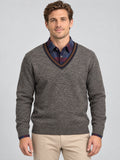 Front studio view of a model wearing a Brown men's Sweater Pullover with a textured knit and striped V-neck.