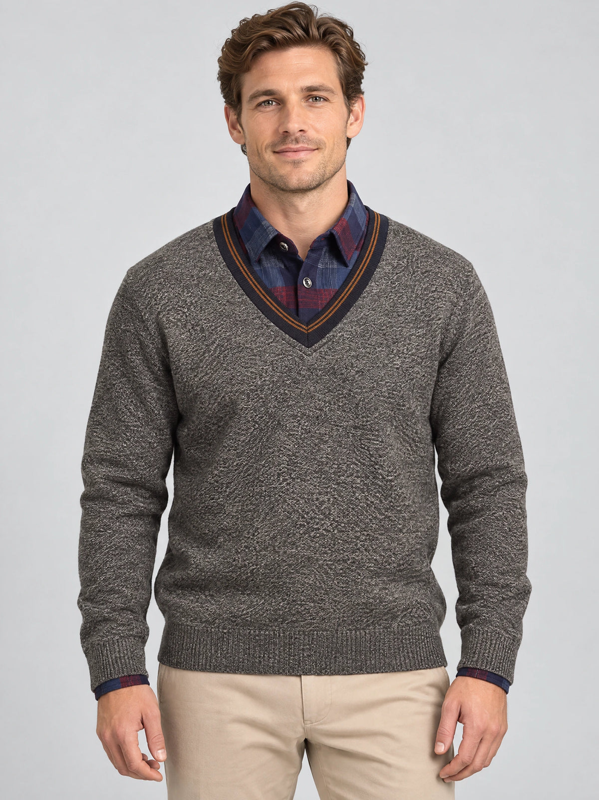 Front studio view of a model wearing a Brown men's Sweater Pullover with a textured knit and striped V-neck.