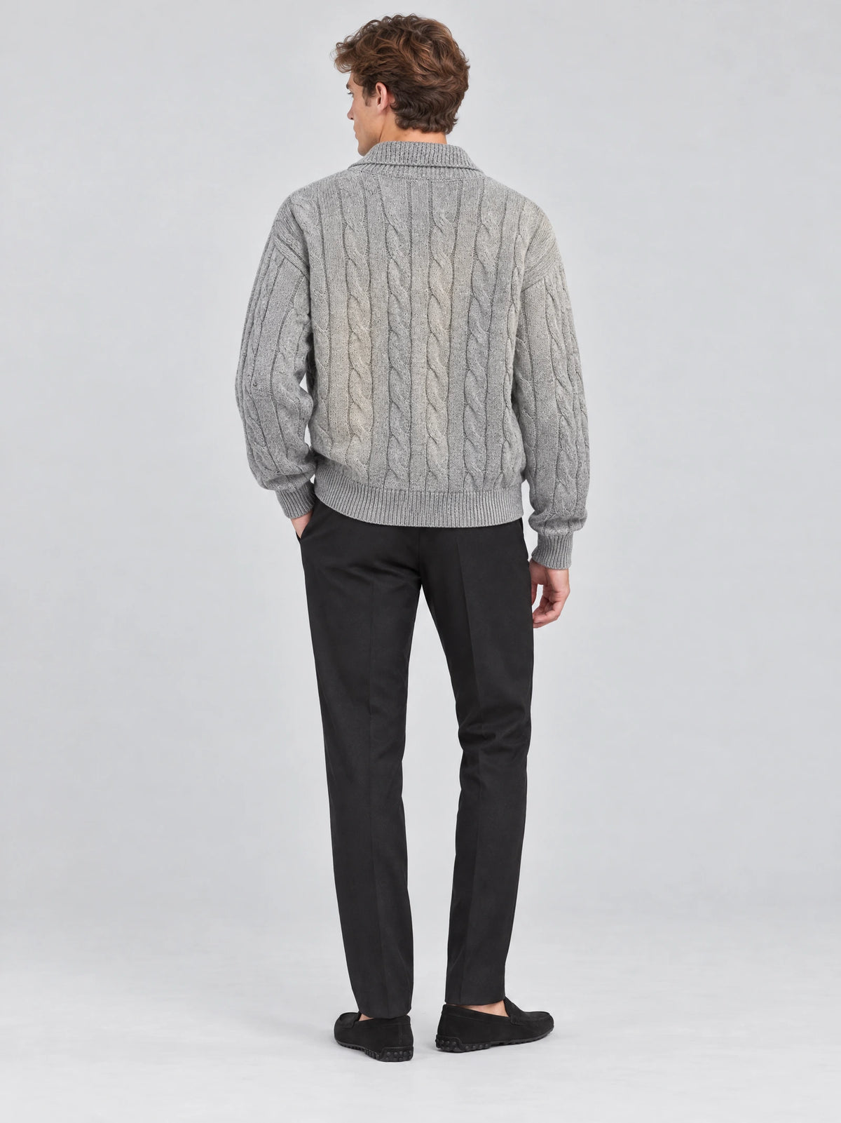 Rear view of a model wearing a Gray cotton Quarter Zip Sweater with cable-knit texture and ribbed trim.