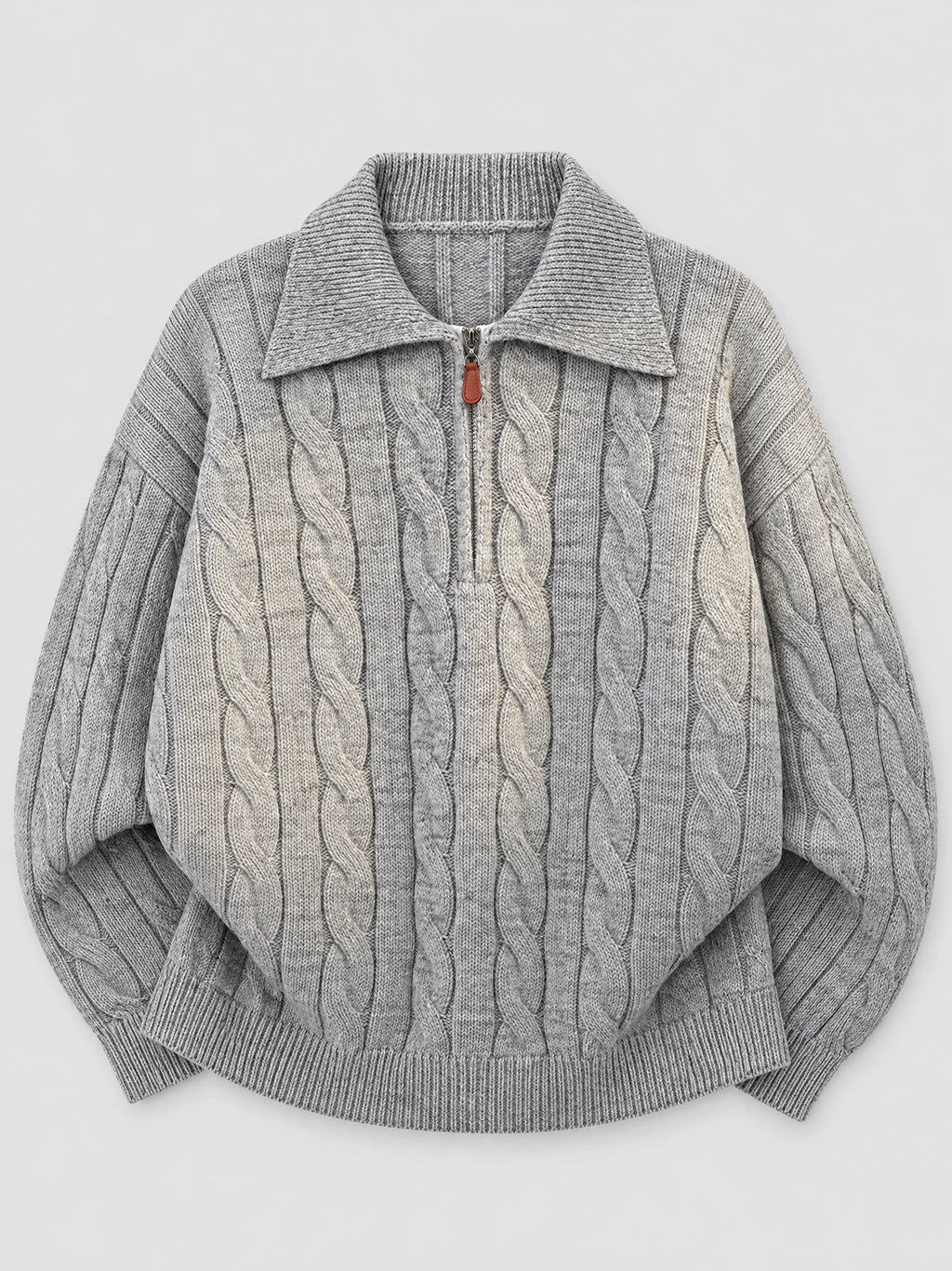 Gray cotton quarter zip sweater laid flat, featuring cable-knit panels, a polo collar, and ribbed cuffs and hem.