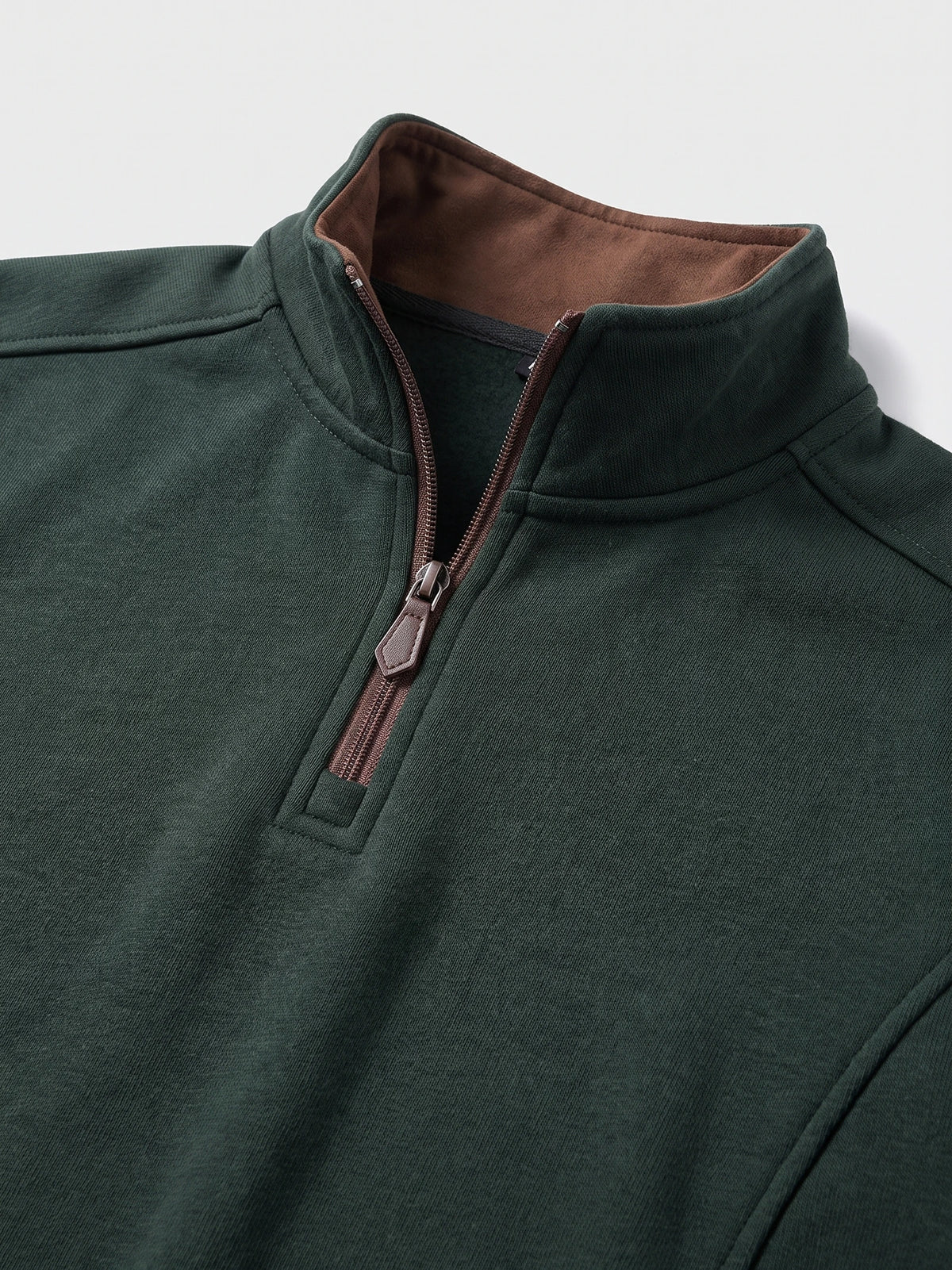 Close-up of the Green men's Quarter Zip Sweater showing the stand collar, zipper pull, and soft inner collar lining.