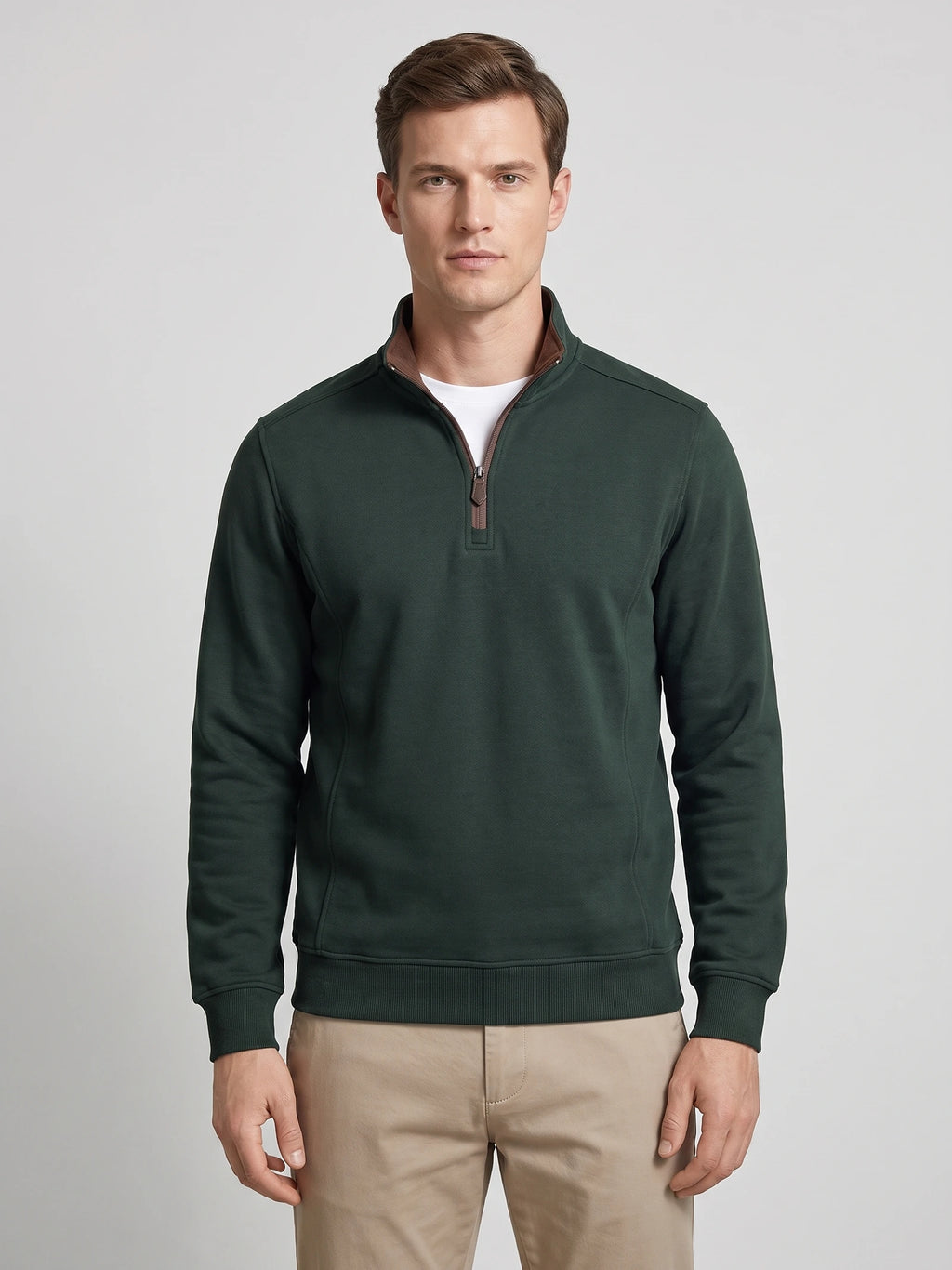 Front studio view of a model wearing a Green quarter zip sweater with a stand collar and long sleeves.