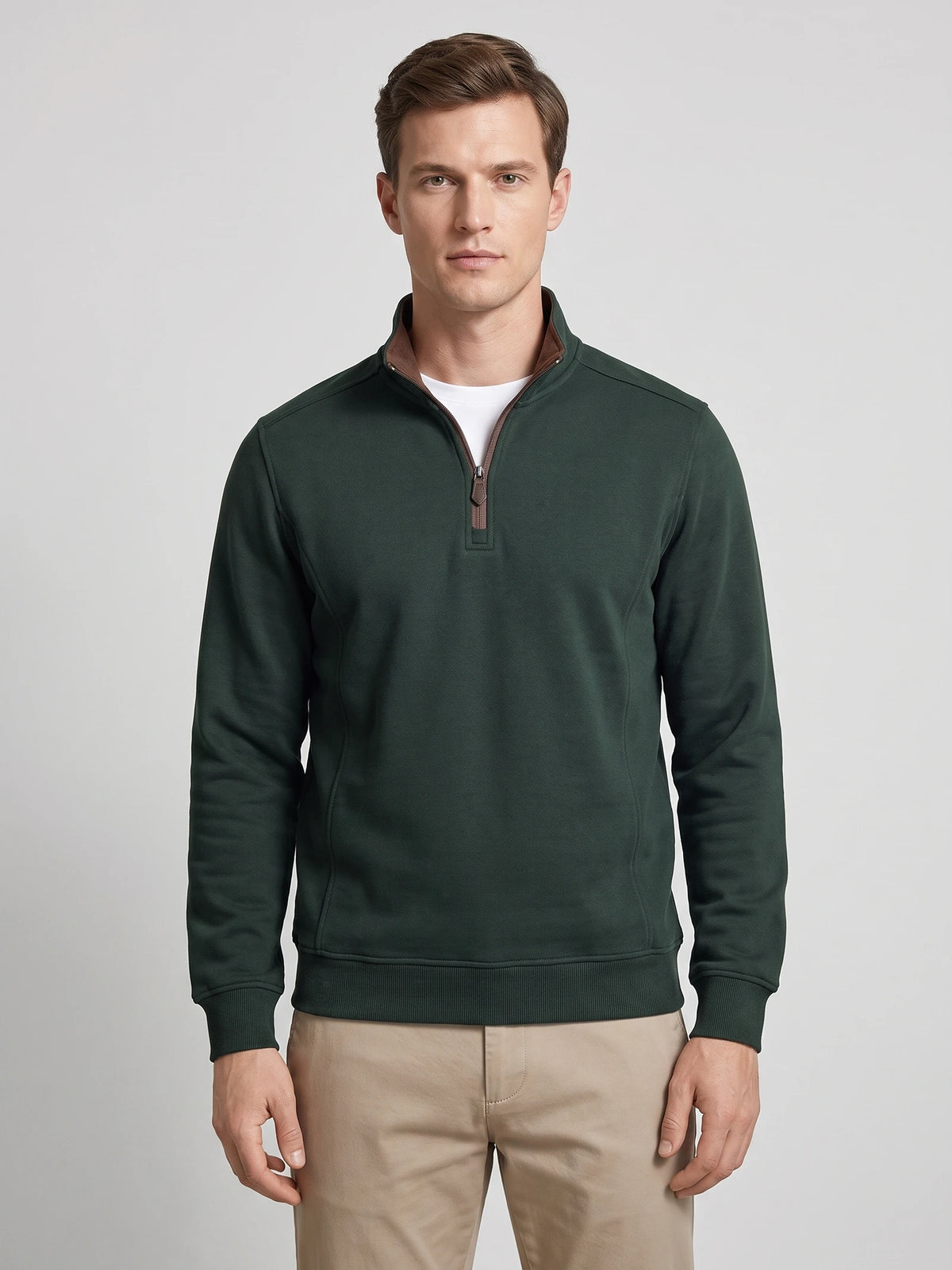 Front studio view of a model wearing a Green quarter zip sweater with a stand collar and long sleeves.