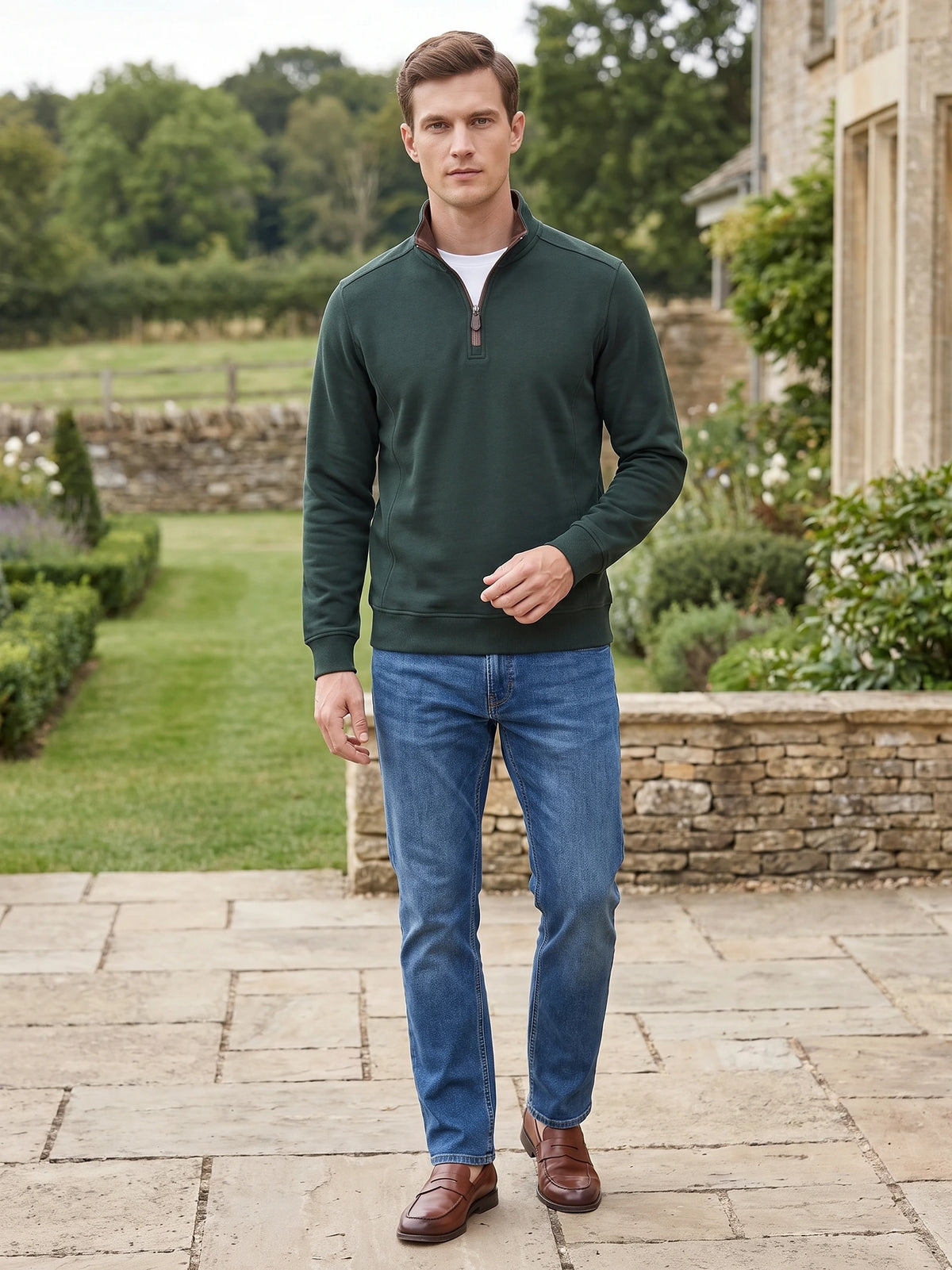 Model walking on a garden path in a Green Quarter Zip Sweater with a stand collar and long sleeves.