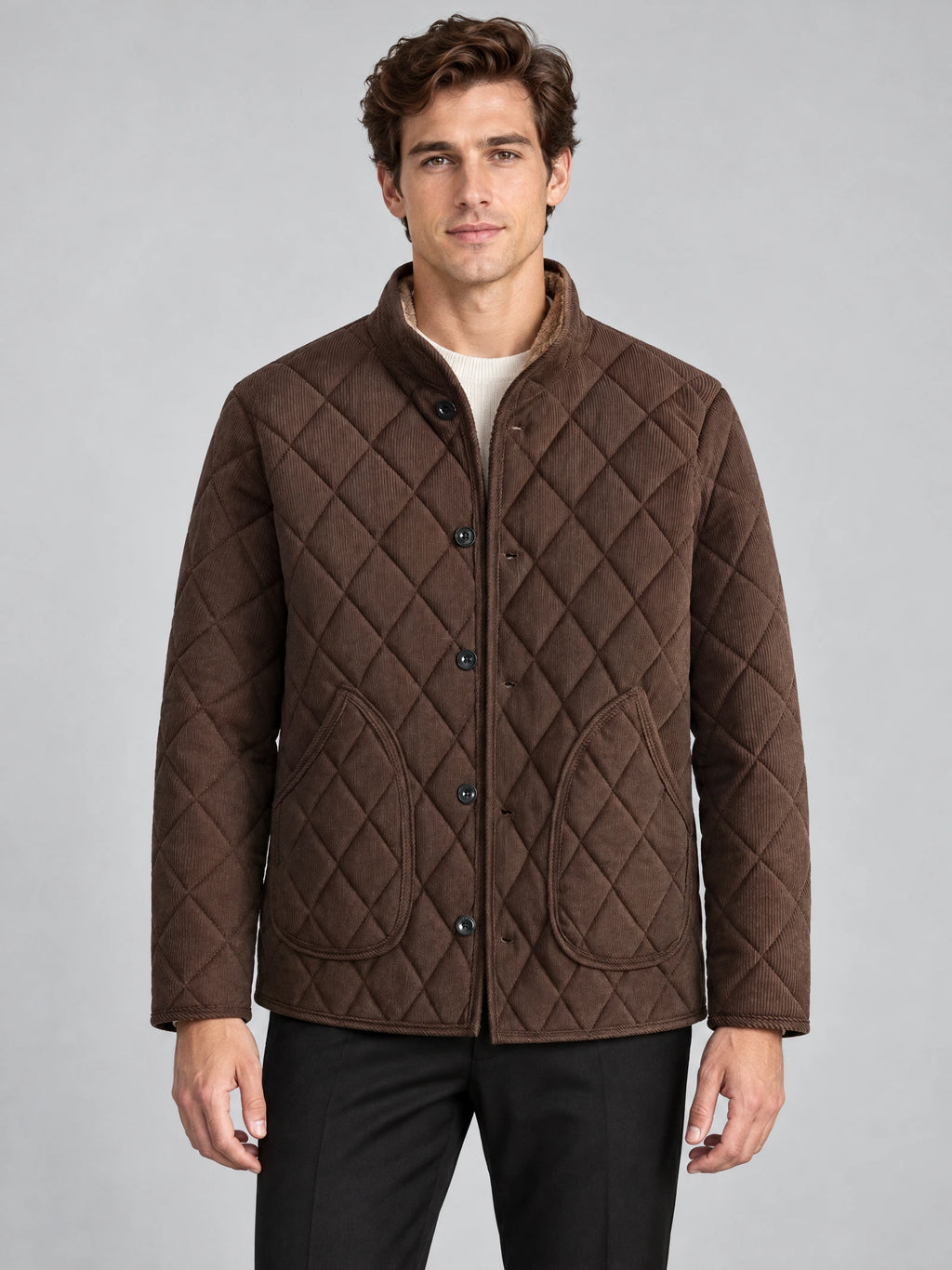 Front studio view of a model wearing a Brown Quilted Field Jacket with diamond stitching, button closure, and patch pockets.
