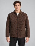Front studio view of a model wearing a Brown Quilted Field Jacket with diamond stitching, button closure, and patch pockets.