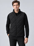 Front studio view of a model wearing a Black Quilted Puffer Vest with diamond quilting, zip front, stand collar, and zip pockets.