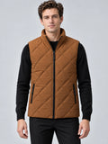 Front studio view of a model wearing a Brown Quilted Puffer Vest with a stand collar, full zip closure, and zip pockets.