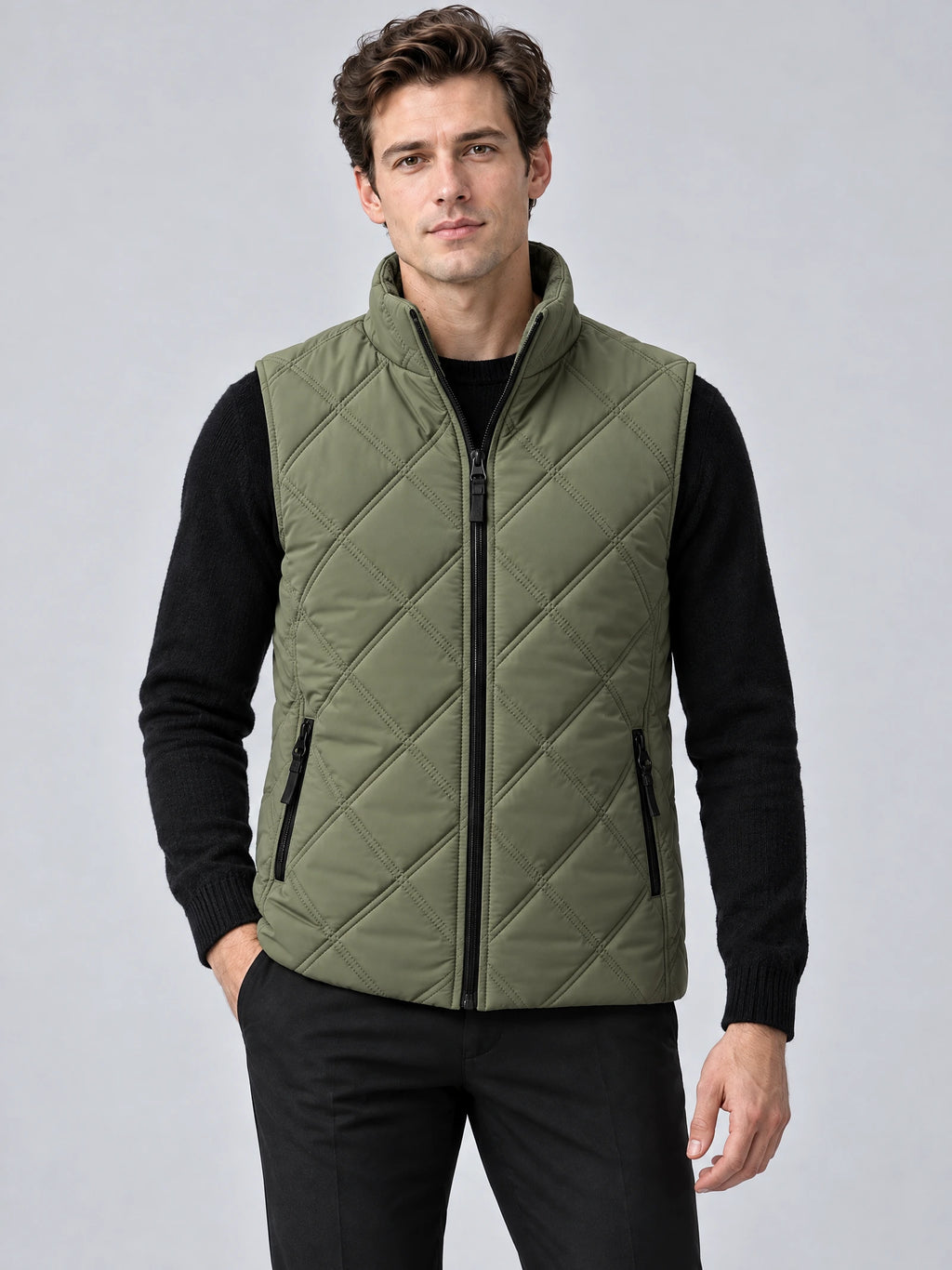 Front studio view of a model wearing a Green Quilted Puffer Vest with diamond quilting, stand collar, and zippered pockets.