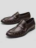 Brown ruched leather loafers with penny straps and stitched moc toes, shown as a pair on a studio background.