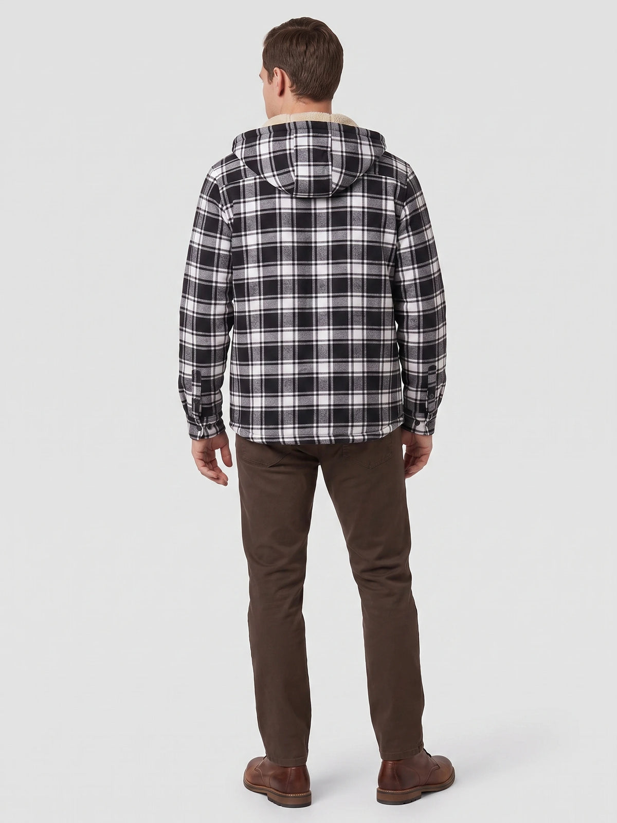 Rear studio view of a model wearing a Black plaid Sherpa Lined Jacket with a hood and button cuffs.